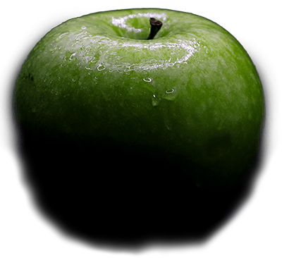 A green apple that falls into the scene.