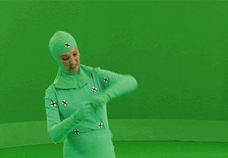 Lisa Kudrow dancing in a mocap suit in front of a green screen