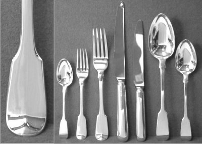 A selection of silverware with a close up of a handle
