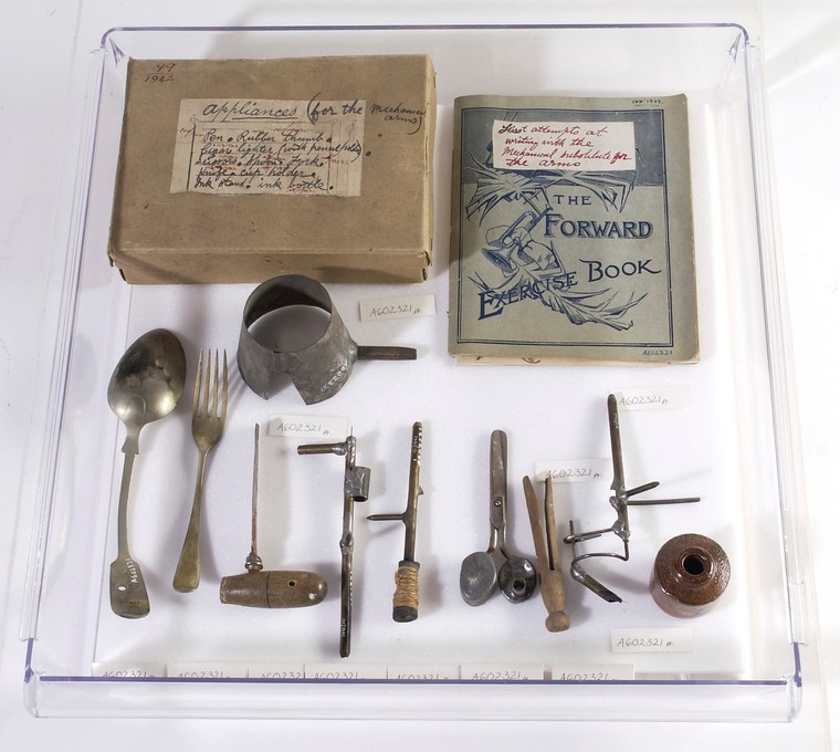 A display box full of old utensils